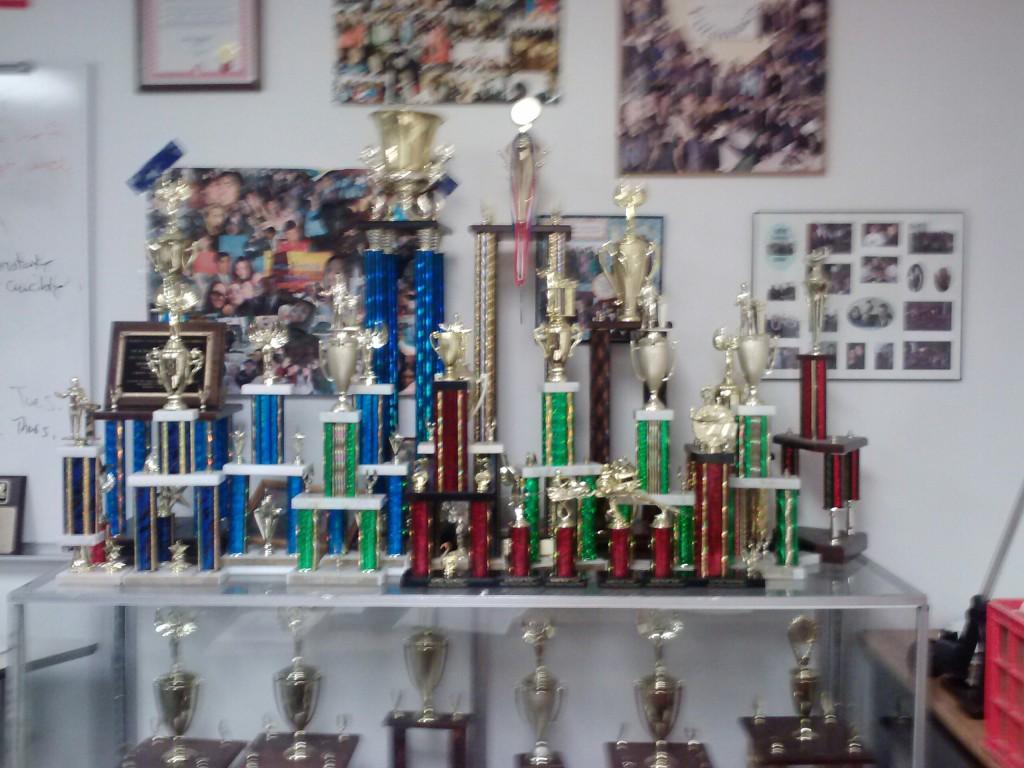 The top shelf is a collection of trophies that WB debate team has won in just the past few years. 