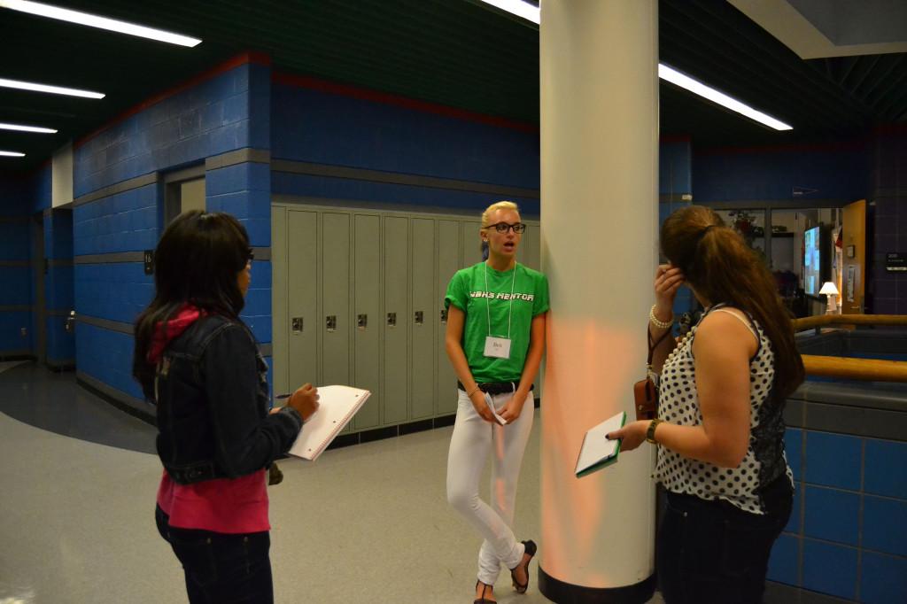 Spectrum writers Ajah Williams (sophomore) and Tara Naoum (junior) interviewing Peer Mentor Britney Birr 
(senior).