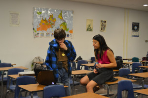 Seth Oldenburg  and Kathy Wu prep before debating 