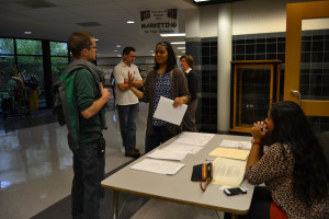 Saheli Ghosh explains debate to Assistant Principle Arthur Ebert 