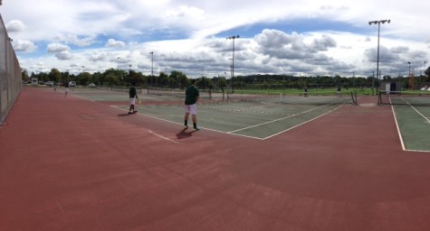 Two Varsity players working on their skills in-between games.