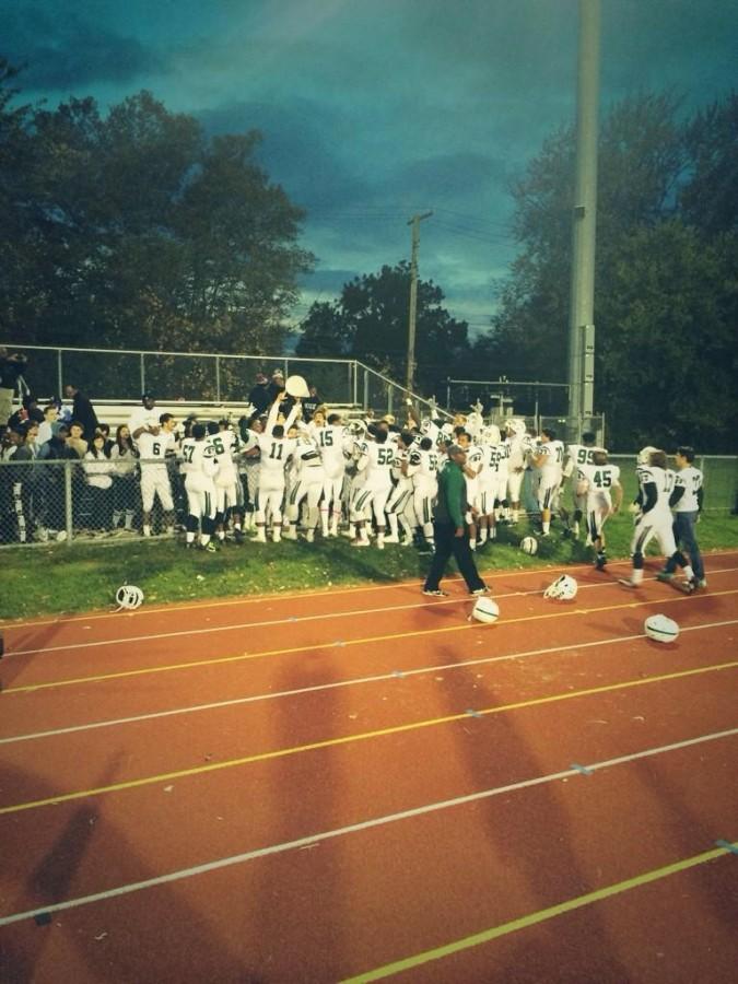 The WBHS Varsity football team celebrates a well fought victory against Southfield High School