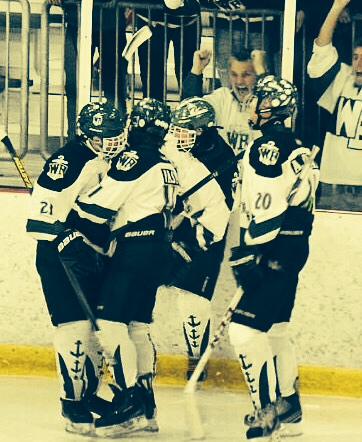 Lakers celebrate a victory on the freezing ice