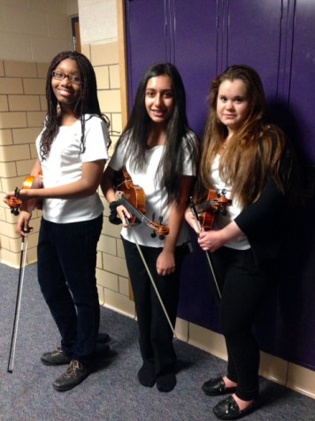WBHS Orchestra members pose with their insturments