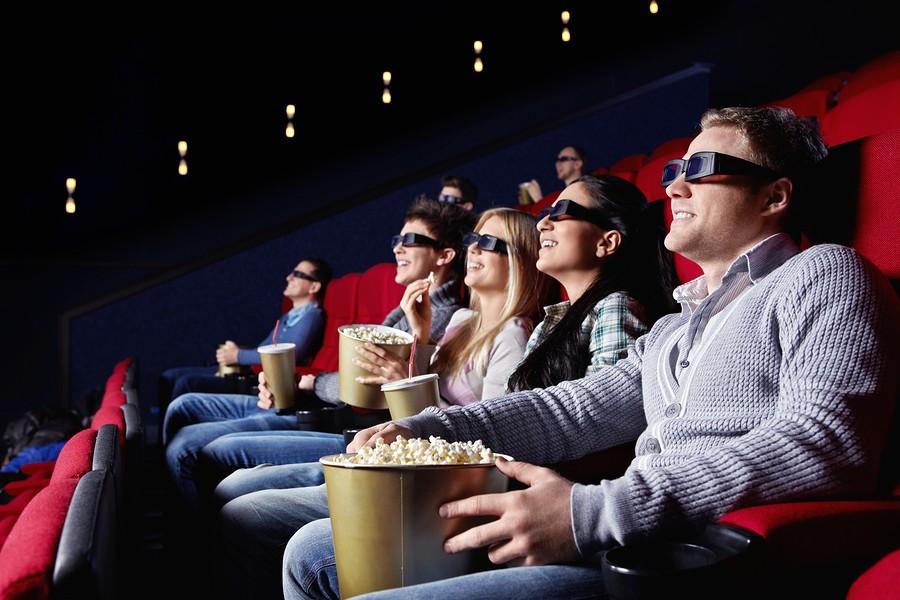 Young people watch movies in cinema