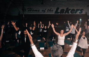 Photo of students practicing yoga by Ben Goldman 