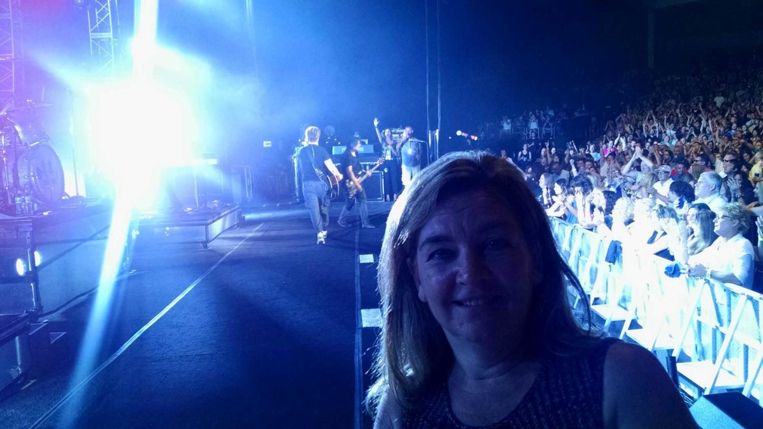Mrs. McHardy on stage at a Goo Goo Dolls concert.