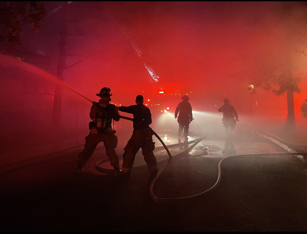 Jeff Latkowski responding to a call and in action while putting out a fire.
