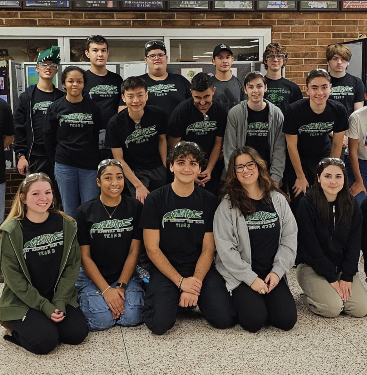 The entire robotics team with Columbus in the upper left corner
