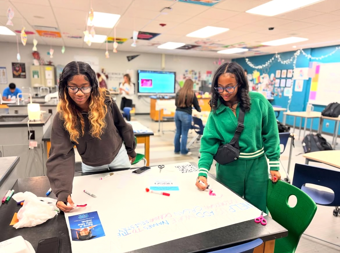 HOSA members creating the gift of life posters during a meeting, after school in Mrs.Danton’s room